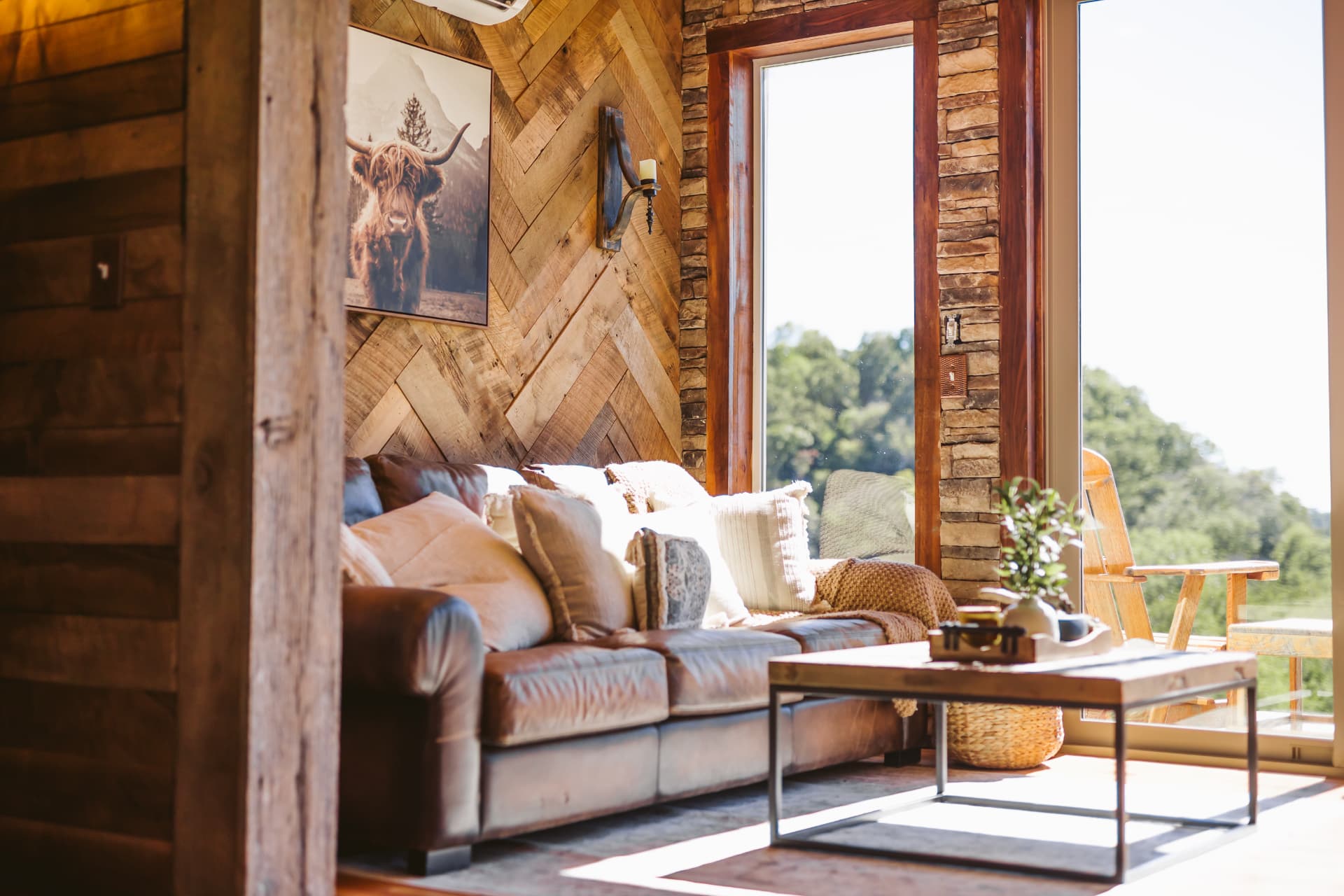 Living room with leather sofa and valley views