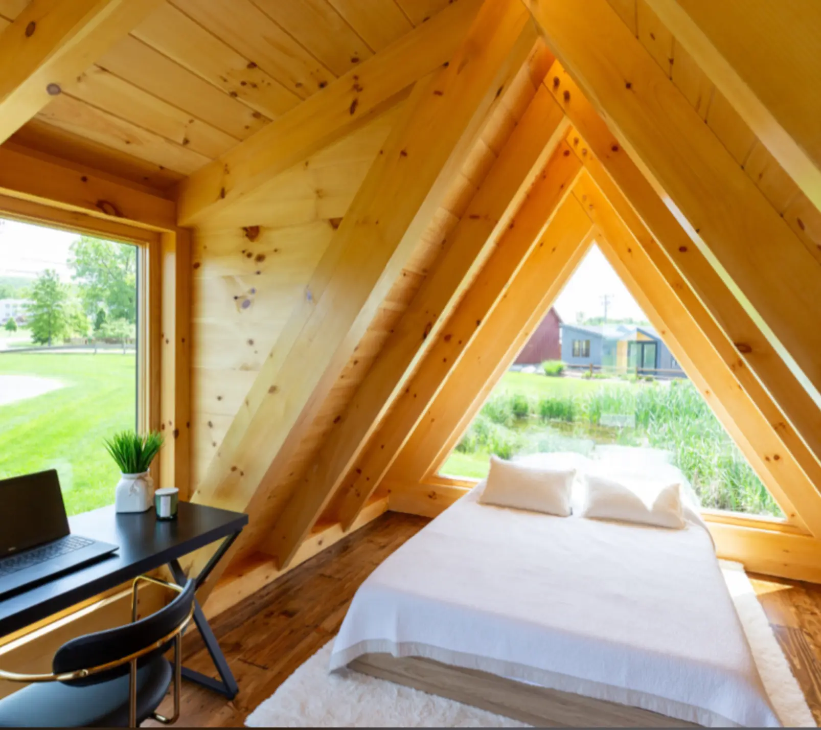 Lofted bed beneath A-frame beams
